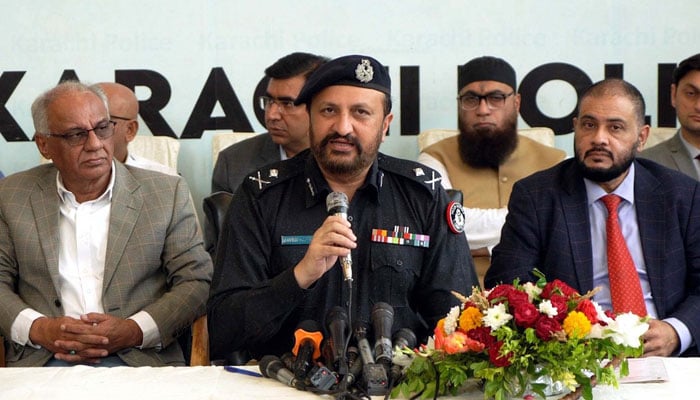 Addl IG Javed Alam Odho (centre) talking during the distribution ceremony of motorcycles to ladies police in Karachi on December 3, 2024. — PPI