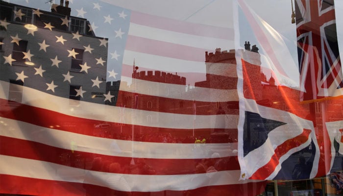 US and UK flags are seen through a glass in this undated image.— AFP/File