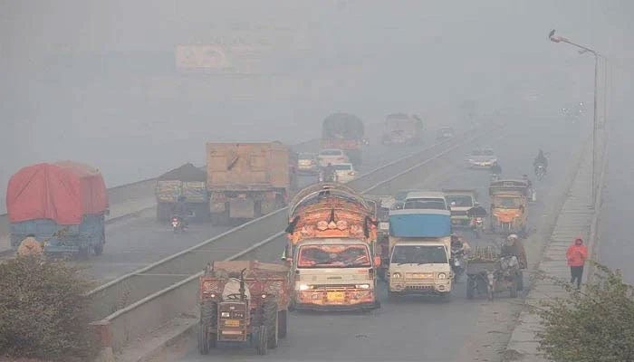 Vehicles move amid dense smog in Lahore, Pakistan. — Reuters/File