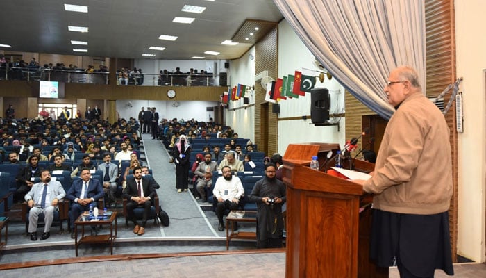 Federal Minister for Housing and Works Mian Riaz Hussain Pirzada addresses the international conference on Re-Imagining the Real Estate: Sustainable Market Growth and Urban Planning at NUML on December 4, 2024. — Facebook@NUMLOFFICIALPAGE