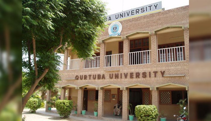 A man sits at the entrance of the Qurtaba University in Dera Ismail Khan. — Facebook@Qurtub.University/File