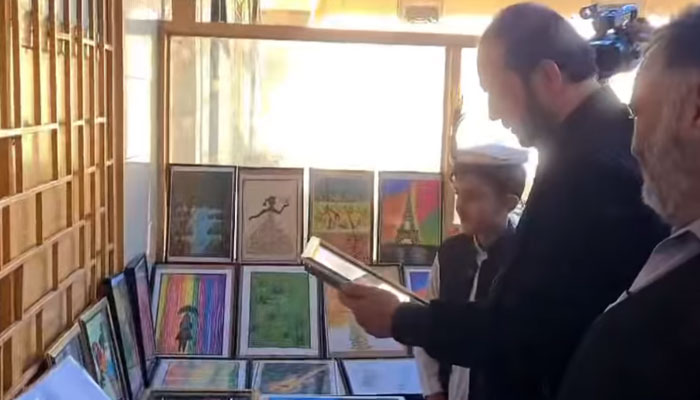 Swat Mayor Shahid Ali Khan (centre) visits a stall at a one-day science, arts, and cultural exhibition at Khpal Kor Model School and College Boys Campus, Makanbagh on December 4, 2024. — Screengrab via Facebook@ShahidAliMayor