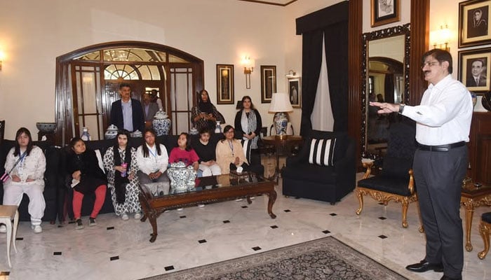 Sindh Chief Minister Syed Murad Ali Shah (right) talking to children with Down syndrome at the Chief Minister’s House on December 5, 2024. — Facebook@SindhCMHouse