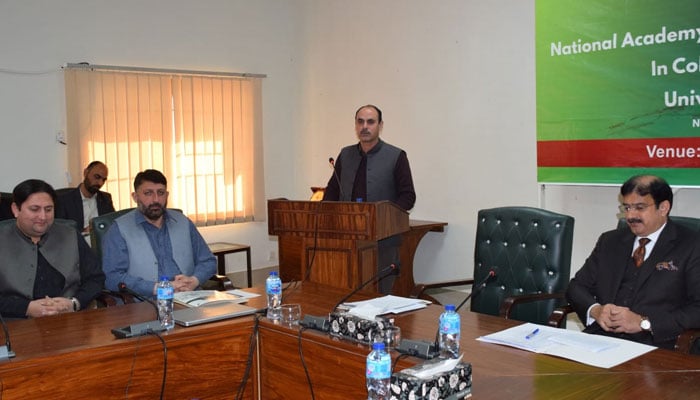 Vice-Chancellor of the University of Swat, Prof Dr Hassan Sher (centre) speaks at a four-week National Outreach Programme for Higher Education Faculty (Tier-I) organised by the University of Swat, in collaboration with the NAHE on December 6, 2024. — Facebook@universityofswat