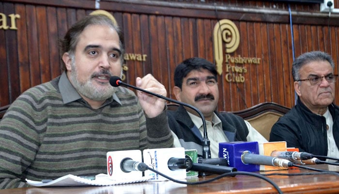 PTI leader and Member National Assembly (MNA) from Peshawar Arbab Sher Ali (left) addresses media persons during a press conference, at the Peshawar press club on December 6, 2024. — PPI