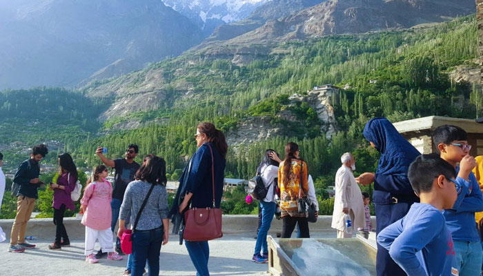 This representational image shows people enjoying the view at a tourist destination in KP. — APP/File