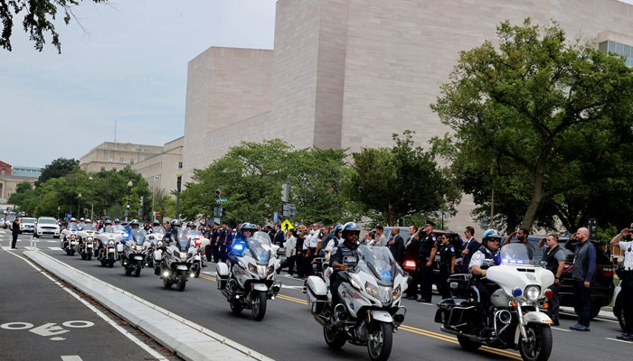 Pentagon Force Protection Agency and other police departments ride in a ceremonial procession past the East Wing of the National Gallery of Art. — Reuters/File