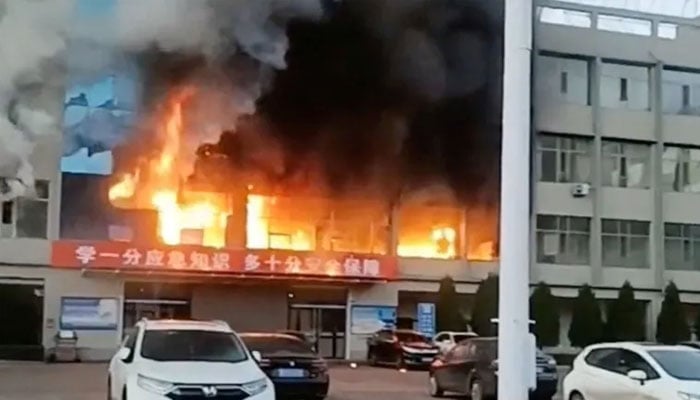 Fire burns at the Yongju Coal Industry Joint Building, in Luliang City, Shanxi province, China. — Reuters/File