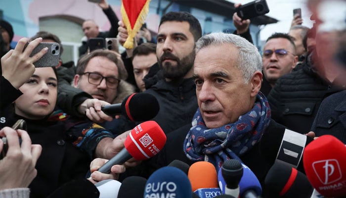 Romanian independent far-right presidential candidate Calin Georgescu gives a statement outside his voting station after the annulation of the presidential elections, in Mogosoaia, Romania, December 8, 2024. — Reuters