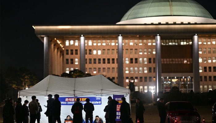 Demonstrators take part in a sit-in protest calling for the ouster of South Korea President Yoon Suk Yeol on the grounds of the National Assembly in Seoul. — AFP/File