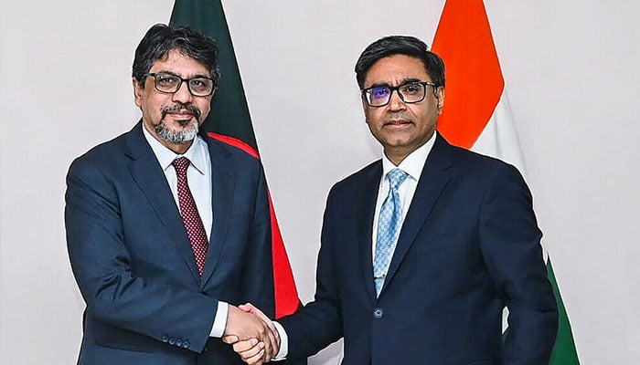 This handout photograph taken on December 9, 2024 and released by Bangladesh’s Ministry of Foreign Affairs shows India’s foreign secretary Vikram Misri (right) shaking hands with his Bangladesh’s counterpart Mohammad Jashim Uddin during a meeting in Dhaka. — AFP