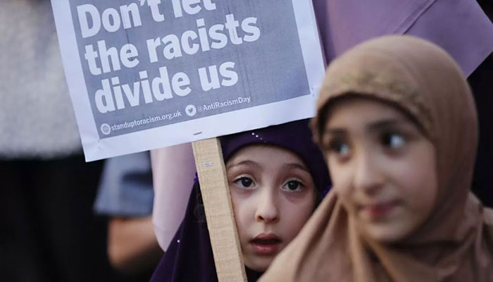 This representational image shows the children holding a protest placard. — AFP/File