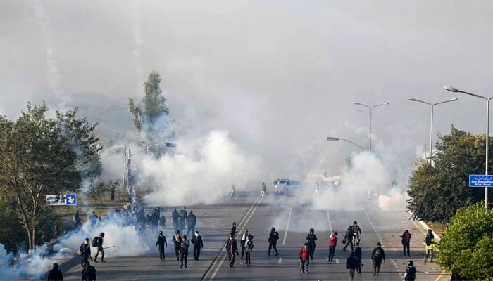 Policemen fire tear gas shells to disperse supporters of the PTI party during a protest to demand the release of former prime minister Imran Khan, in Islamabad on November 26, 2024. — AFP