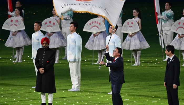 Governor of Aichi prefecture, Hideaki Omura (centre), at the closing ceremony of the Hangzhou Asian Games. — AFP