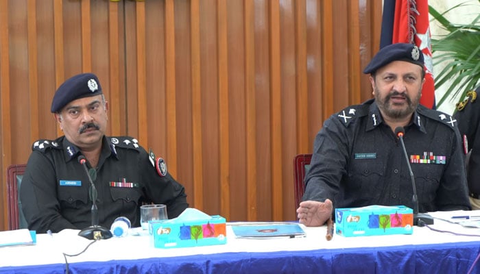 Karachi police chief Javed Alam Odho (right) speaks to media persons at the Karachi Traffic Police headquarters  on December 11, 2024. — Screengrab via Facebook@KarachiPoliceOfficial