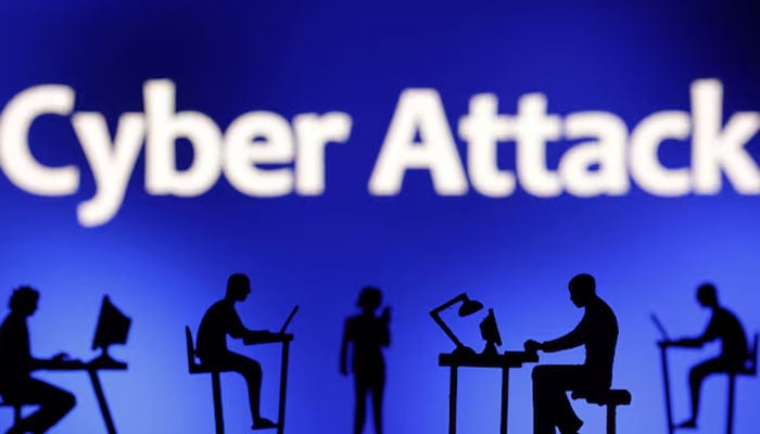 Figurines with computers and smartphones are seen in front of the words Cyber Attack in this illustration taken, February 19, 2024. — Reuters