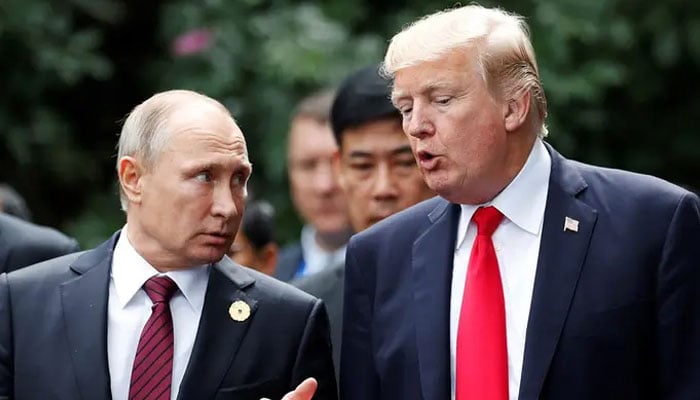 US president-elect Trump (right) and Russian President Vladimir Putin talk at the APEC Summit in Danang, Vietnam. — Reuters/File