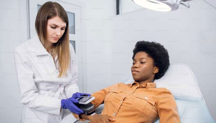 A representational image of a doctor examining a patient. —Unsplash/File