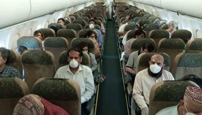 Representational image of Pakistani passengers on board a plane. — APP/File