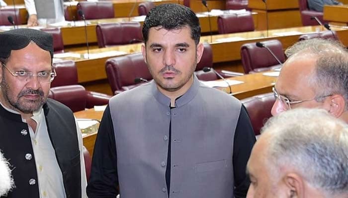 An undated images shows Adil Bazai with members of opposition during a meeting in the National Assembly, Islamabad. — Instagram@adilbaxai/File