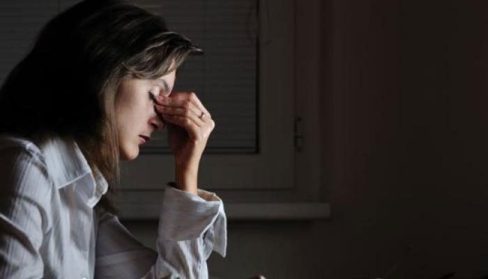 The representational image shows a woman in stress. — AFP/File