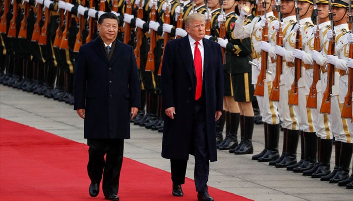 US President-elect Donald Trump takes part in a welcoming ceremony with Chinas President Xi Jinping in Beijing, China, November 9, 2017. — Reuters