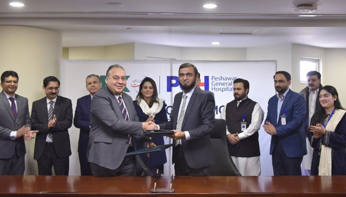 Officials shaking hands after signing an MOU between the Bank of Khyber (BoK) and Peshawar General Hospital (PGH) on December 12, 2024. — Facebook@BankofKhyber