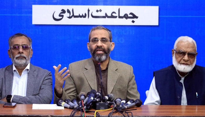 Jamat-e-Islami (JI) Karachi Chief, Munam Zafar (centre) addresses media persons during a press conference, at Idara Noor-ul-Haq in Karachi on December 13, 2024. — PPI