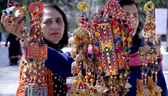 This representational image shows women looking at handicrafts at a stall. — APP/File