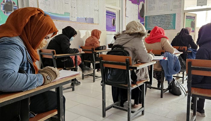 Afghan students take a test at an institute of health sciences in Ghazni.— AFP/File