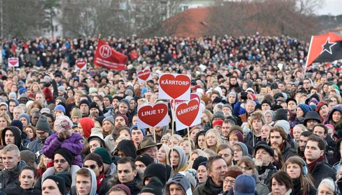 Protesters rally against racism during a demonstration in the Stockholm suburb of Karrtorp December 22, 2013. — Reuters