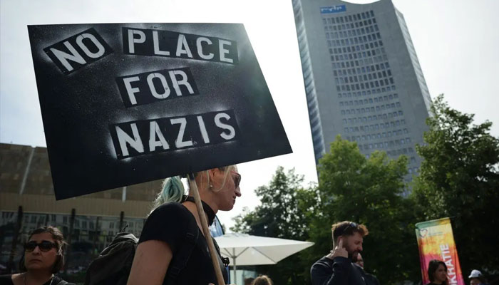 A protesting man carrying an anti-Nazi placard in this undated image. — AFP/File