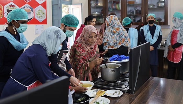 Members of transgender community are seen taking a cooking class at the newly established lab on December 9, 2023. — Reporter