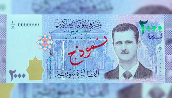 A portrait of Syrias President Bashar al-Assad is seen printed on the new Syrian 2,000-pound banknote that went into circulation on Sunday, in this handout picture provided by SANA on July 2, 2017, Syria. —Reuters