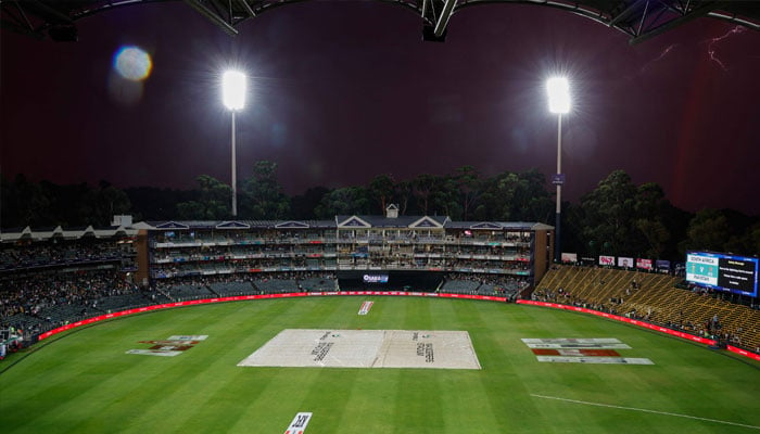 A general view of the electronic board displaying the message due to lightning that is around please find a safe space to shelter during the third T20 international cricket match between South Africa and Pakistan at Wanderers stadium in Johannesburg on December 14, 2024. — AFP