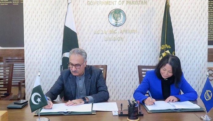 Sectary Economic Affairs Dr Kazim Niaz (left) and Country Director of Asian Development Bank Emma Fan signing agreement for the Integrated Social Protection Development program on saturday.— INP