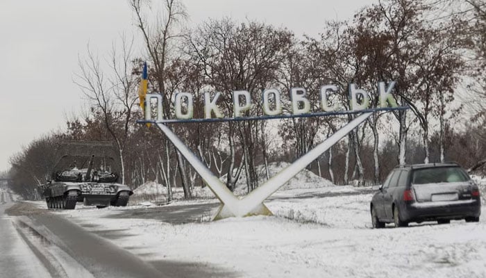 A Ukrainian tank and a car are parked near a road sign that reads, Pokrovsk’, amid Russias attack on Ukraine, in the town of Pokrovsk in Donetsk region, Ukraine December 12, 2024. — Reuters