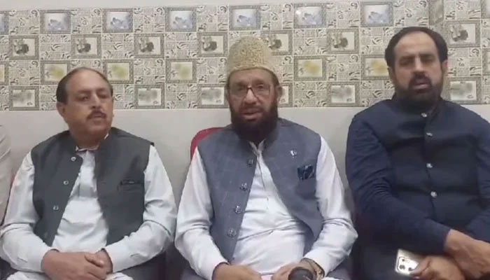 The chairman of Tehreek-i-Sooba Hazara Sardar Mohammad Yousuf (centre) speaks with media persons in this still taken on October 15, 2024. — Facebook@SMYousafofficial