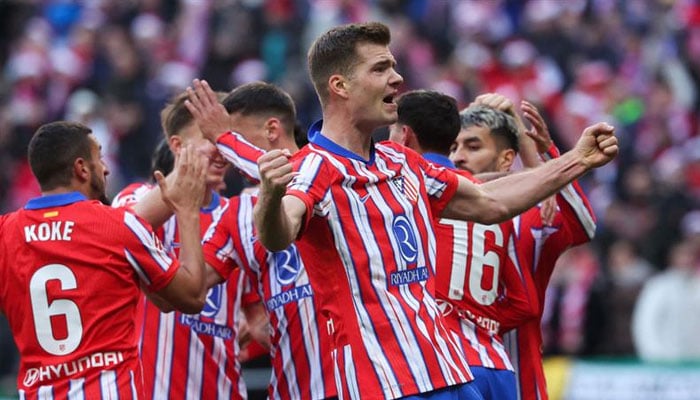 Atletico Madrids Norwegian forward Alexander Sorloth (right) celebrates after scoring their first goal during the Spanish league football match between Club Atletico de Madrid and Getafe CF at the Metropolitano stadium in Madrid. — AFP