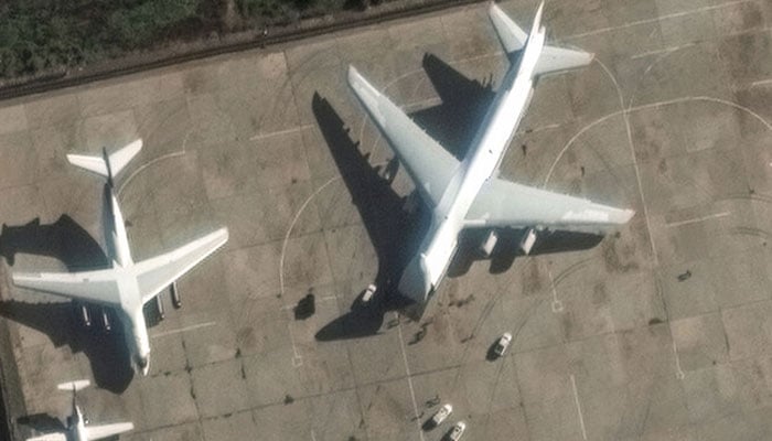 This handout satellite image released by Maxar Technologies on December 13, 2024 shows an Antonov An-124 heavy transport aircraft preparing to load equipment at the Russian Hmeimim Air Base in Syrias western province of Latakia.— AFP