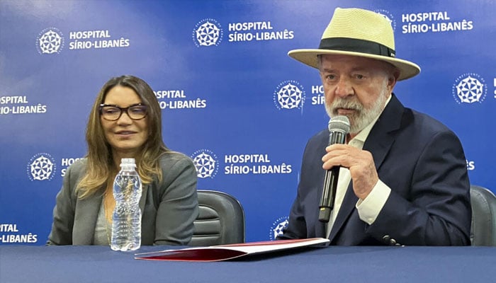 Brazils President Luiz Inacio Lula da Silva speaks to reporters, accompanied by his wife Rosangela Janja da Silva, after being discharged from Hospital Sirio-Libanes in Sao Paulo. —AFP