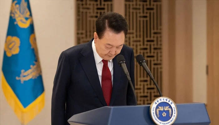 South Korean President Yoon Suk Yeol l bowing while delivering a televised address in Seoul on December 12, 2024. —AFP