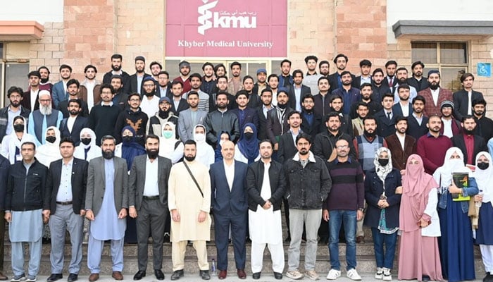 Participants pose for a group photo at a seminar on the evolving role of pharmacists in the modern healthcare system at Khyber Medical University (KMU) on December 16, 2024. — Facebook@kmupeshawarofficial