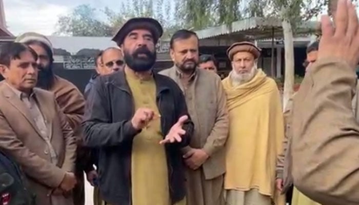 PMLN leader Pir Syed Zulfiqar Bacha (centre) addresses the presser on December 14, 2024. — Screengrab via Facebook@Pir Zulfiqar Bacha