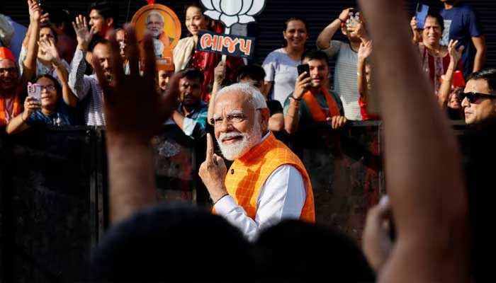 Indias Prime Minister Narendra Modi shows his ink-marked finger after casting his vote during the third phase of the general election, in Ahmedabad, India, May 7, 2024. — Reuters