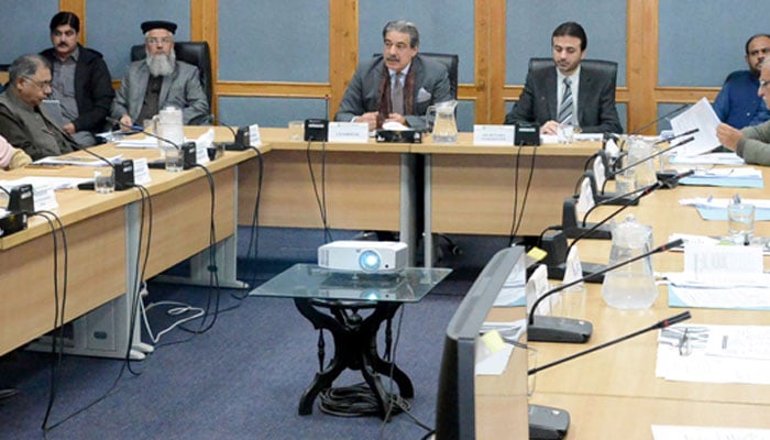 Chairman of the Senate Standing Committee on Housing and Works Senator Nasir Mahmood presides over a meeting at Parliament Lodges on December 17, 2024. — APP