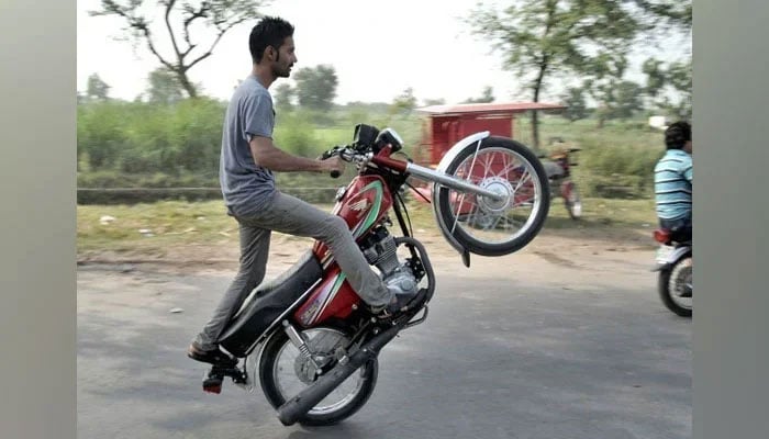 Representational image shows a young boy performing street stunts on a motorcycle this image released on May 27, 2019. — Facebook@alterbaikRiderRanipurking