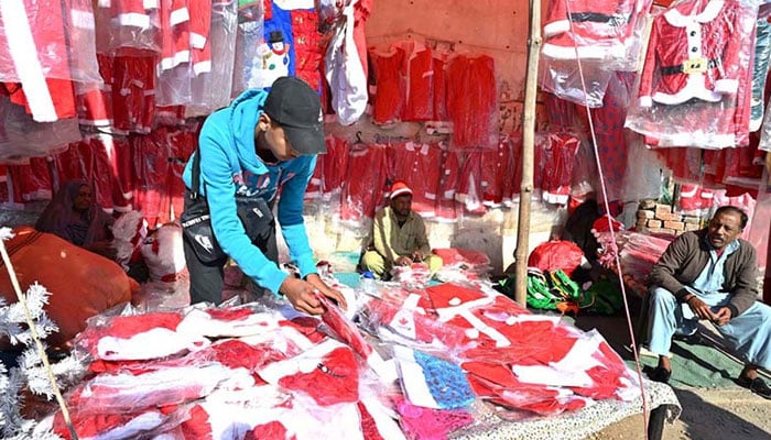 This representational image shows a vendor displaying costumes for an upcoming Christmas ceremony. — APP/File