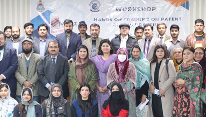 Participants pose for a group photo during a hands-on training workshop on ‘Patent drafting and filing’ in the Institute of Chemical Engineering & Technology seminar hall on December 19, 2024. — pu.edu.pk