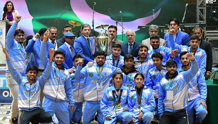 The winning team of Punjab pose for a photo with the Quaid-e-Azam trophy during the closing ceremony of the Quaid-e-Azam Inter-Provincial Games 2024 on December 19, 2024. — INP